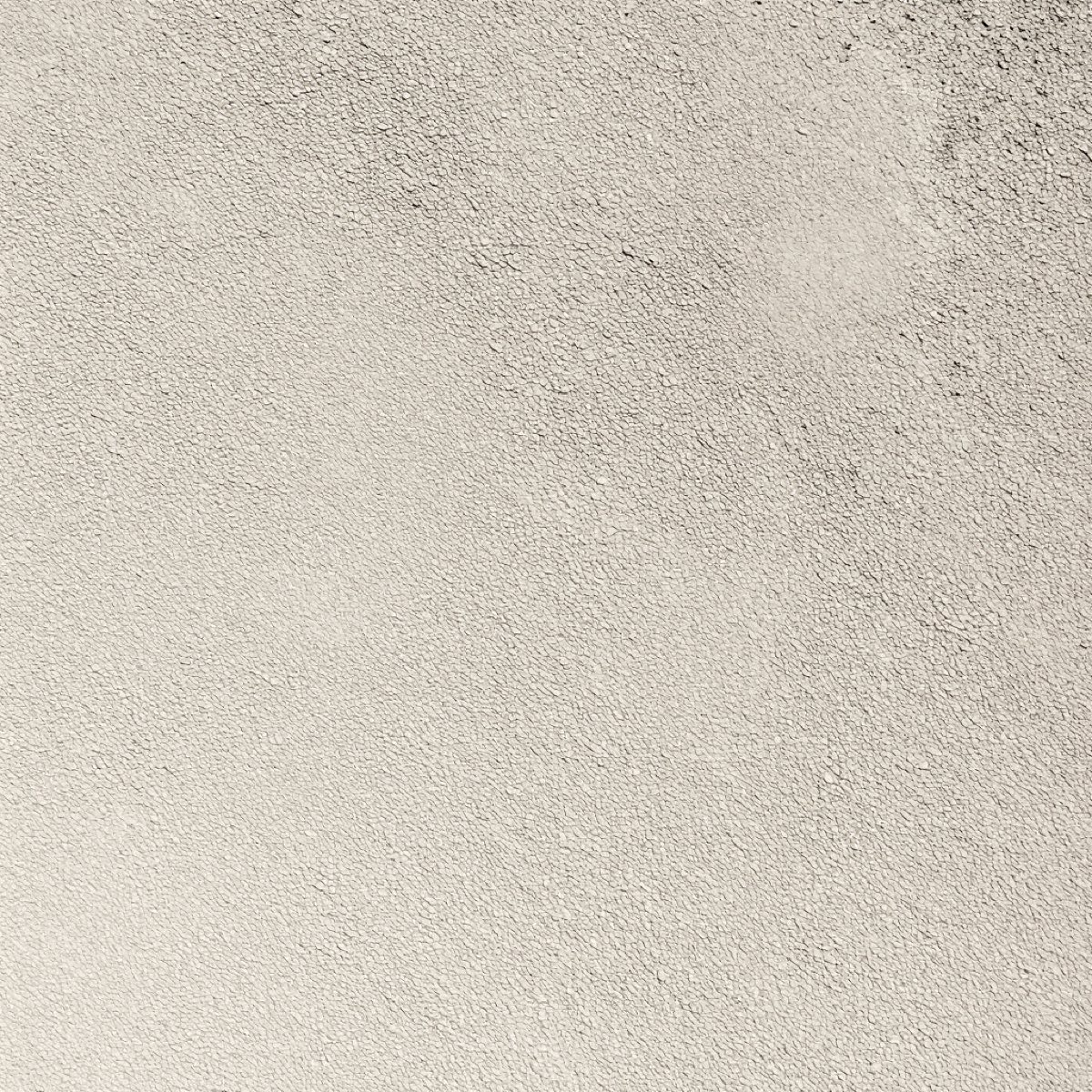 Textura de un muro estucado a mano con luz rasante